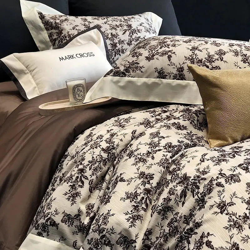 Cream-colored egyptian cotton bedding set with dark brown floral embroidery and ribbed texture including pillowcases