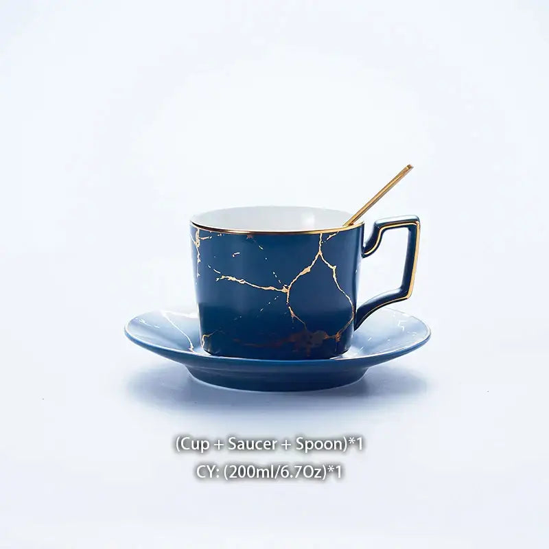 Deep blue marble ceramic tea set cup with gold crackle design and matching saucer with slender golden spoon