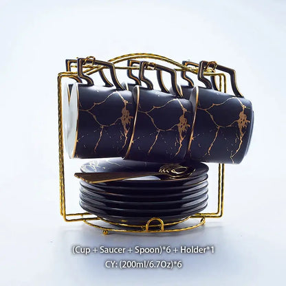 Elegant black marble ceramic tea set with gold veining includes six cups each with saucer and spoon in gold holder