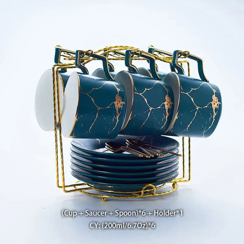 Set of six teal ceramic tea set mugs with gold marble ceramic design on matching saucers in ornate gold holder