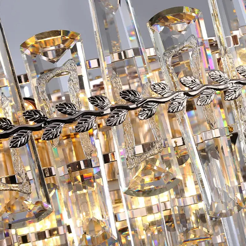 Elegant multi tiered crystal pendant lights with faceted clear glass prisms and silver leaf metal accents for room lights decorbites elegant room