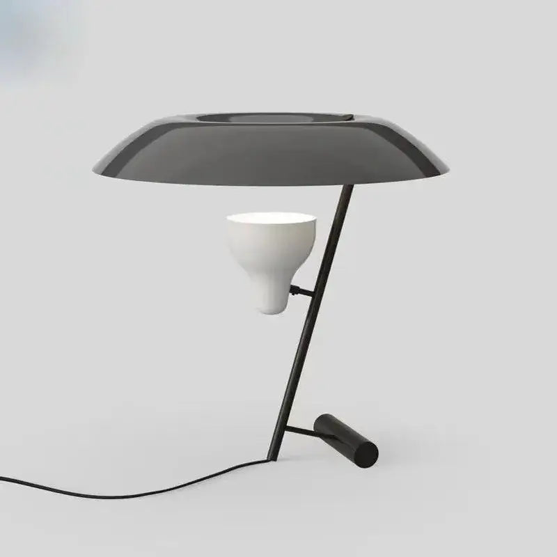 Modern black metal desk lamp with sleek curved shade and white ceramic bulb holder by decorbites elegant nordic desk line