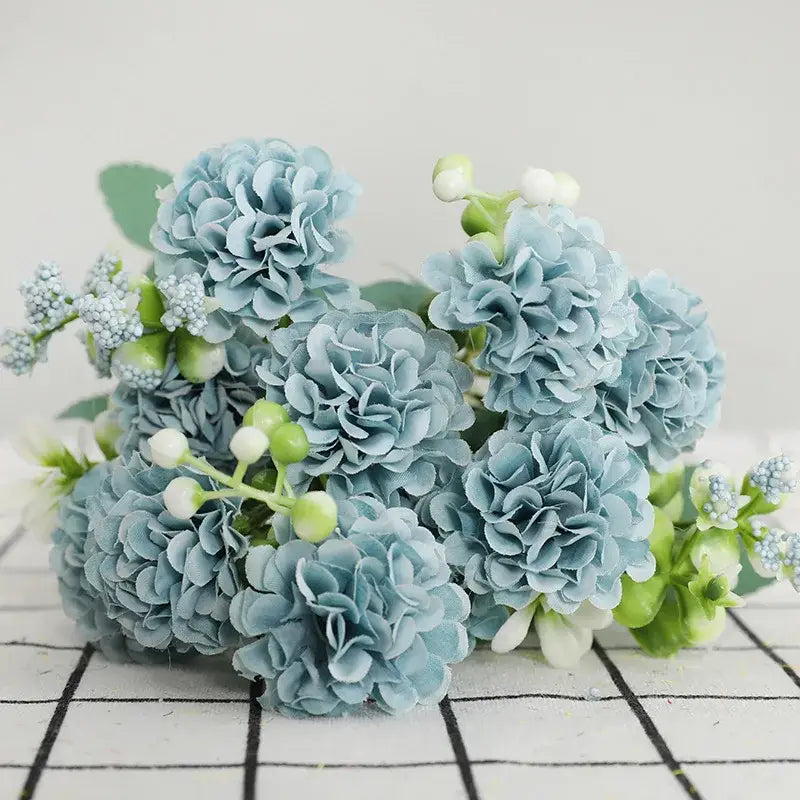 Elegant pink hydrangea decorbites daisy bouquet featuring light blue simulation bouquet with green stems and white berries