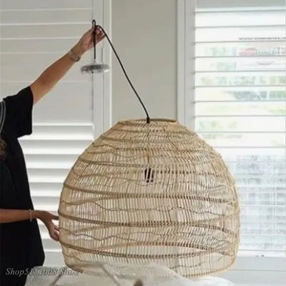 Natural woven rattan pendant light with beige-brown basketweave and black cord from Decorbites elegant rattan wave series