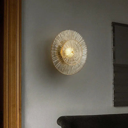Elegant glass wall circular gold-toned ribbed glass wall sconces by decorbites emitting warm light for living room decor