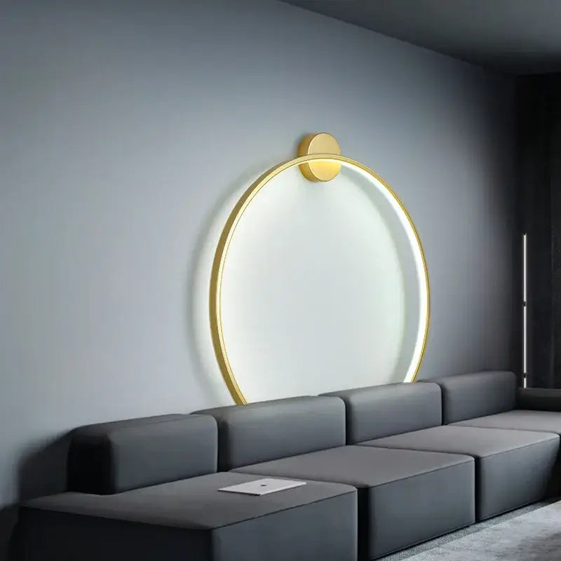 Elegant round gold wall sconce with a glowing ring and minimalist design ideal for bedroom indoor lighting decorbites wall sconces