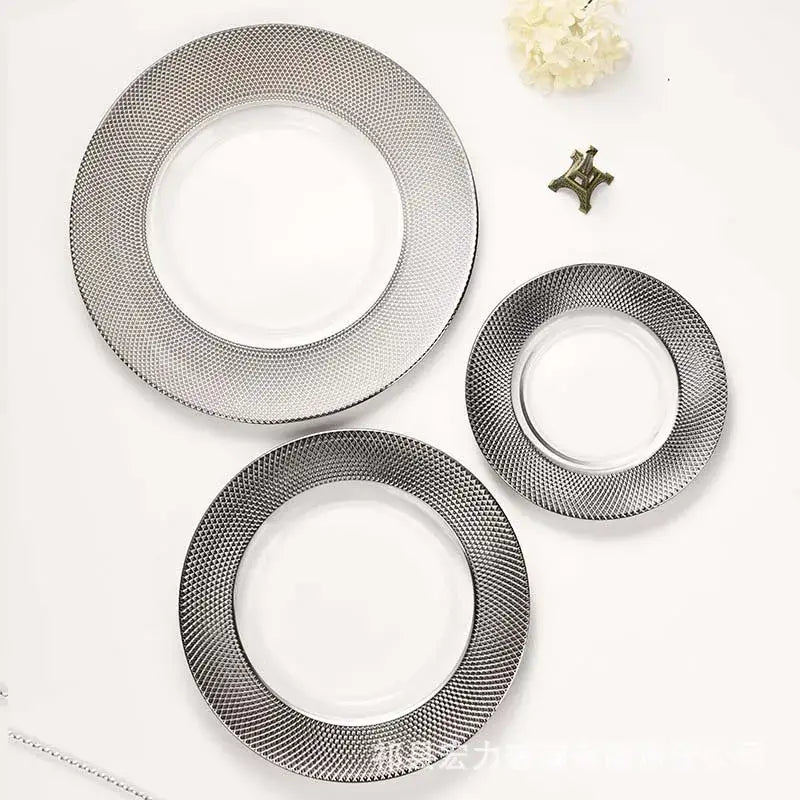 Set of three elegant silver-toned glass steak and pasta plates with textured mesh rim for enhanced dining experience