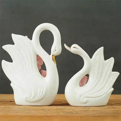 Elegant swan sculpture figurines white ceramic with gold beaks and pink floral accents for living room decorbites decor