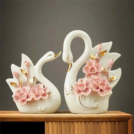 Elegant swan sculpture figurines in white ceramic with pink flowers and gold leaf accents for living room decorbites decor