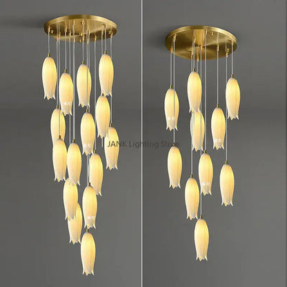 Gold-toned tulip staircase chandelier with cream frosted glass shades hanging from a circular brass base decorbites elegant tulip