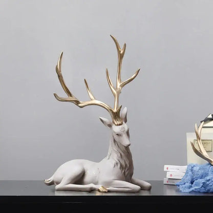 A sleek white ceramic elk figurine with gold antlers and accents decorbites deer sculpture for modern decor