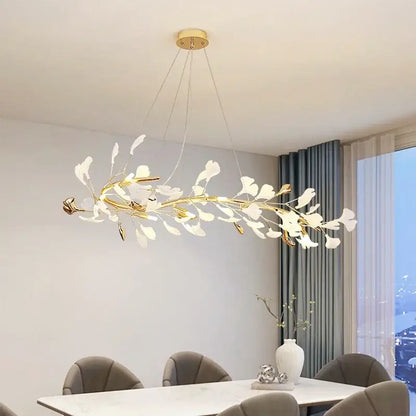 Elegant white and gold ceramic chandelier with delicate ginkgo branch glass elements for dining room decorbites ginkgo branch