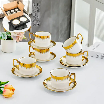 Elegant white and golden ceramic tea cup set with gold-drip detailing by decorbites for dining room drinkware