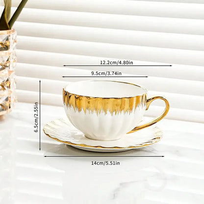 Elegant white and golden ceramic tea cup set with gold leaf detailing for decorbites golden ceramic drinkware collection