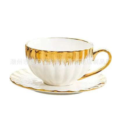 Elegant white and golden ceramic tea cup set with gold leaf detailing and fluted design by decorbites golden ceramic