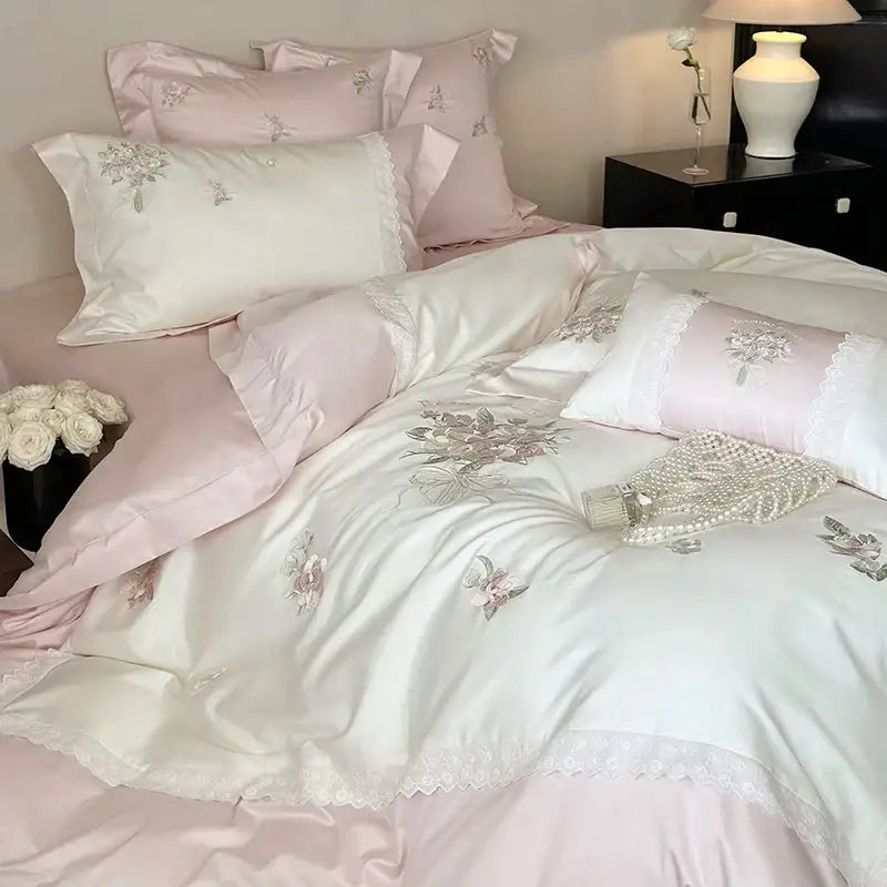 Elegant white flowers embroidery lace bedding set featuring an ivory satin duvet cover with pink accents and floral decorbites flowers embroidery