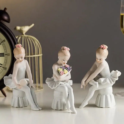 Elegant white porcelain ballet girl figurine set featuring three delicate ballet girl figurines with pink hair buns