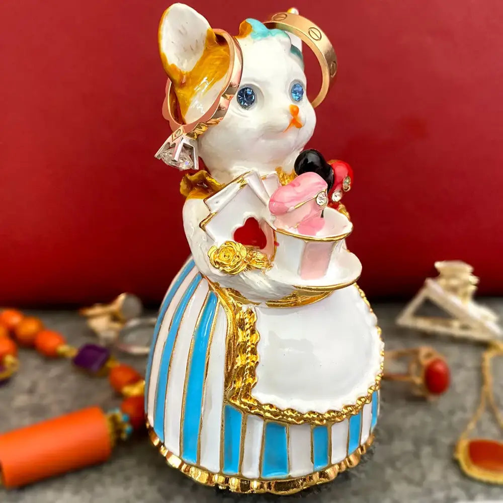 Elegant white porcelain cat jewelry trinket box with gold trim blue eyes and striped blue and white dress decorbites elegant cat