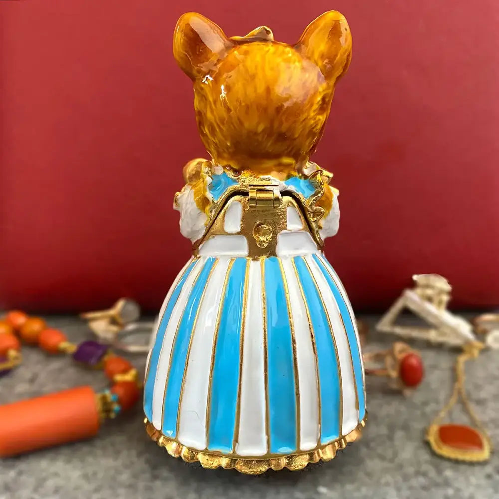 Elegant white porcelain cat jewelry trinket box featuring a glossy amber mouse figurine in blue striped dress decorbites elegant cat decor
