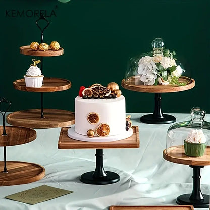 Elegant wood and black metal dried fruit tray holding white cake with dried orange slices and gold accents on wooden stand