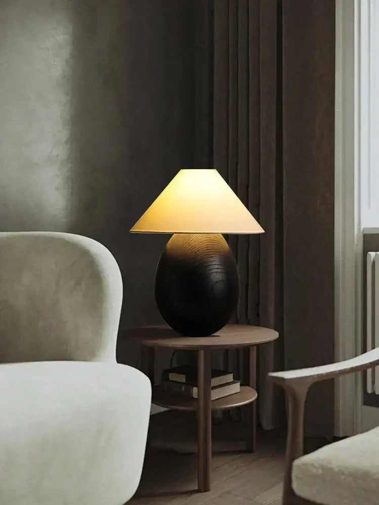 Warm-toned table lamp from decorbites elegant wood set with textured black ceramic base and beige fabric shade for bedroom decor