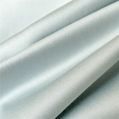 Light gray satin fabric with smooth glossy finish and subtle ribbing in embroidered blue butterfly duvet cover set