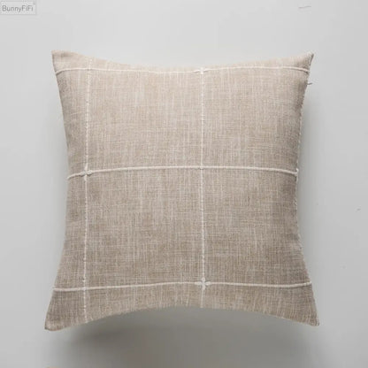 Beige linen cushion with subtle white grid pattern featuring grey stripe embroidery for decorbites brown grey stripe decor
