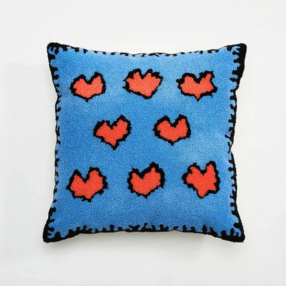 Blue cushion cover with orange hearts and black stitched edges for embroidered daisy dandelion living room decor