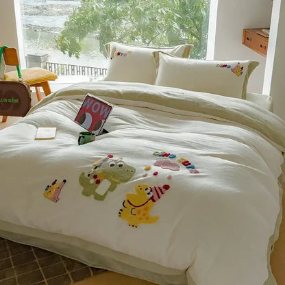 Cream embroidered fleece winter bedding set with quilted duvet featuring playful green and yellow dinosaurs and accessories