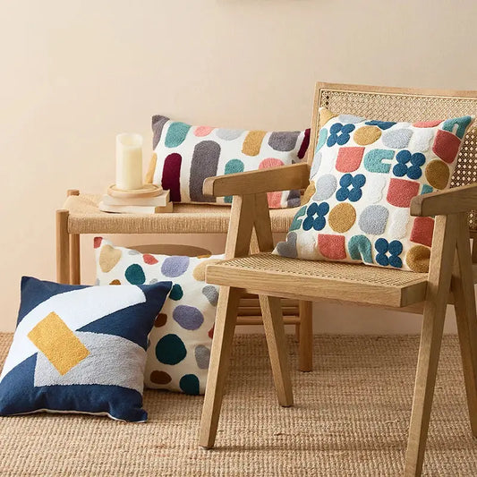 Cozy textured pillow cover with playful geometric pattern in soft pastel and earthy tones for home decor