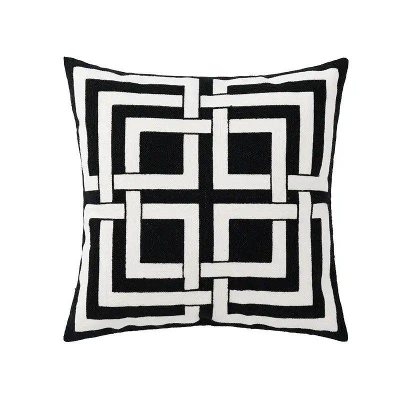 Black and white geometric embroidered pillow cover with bold interlocking squares for living room decor