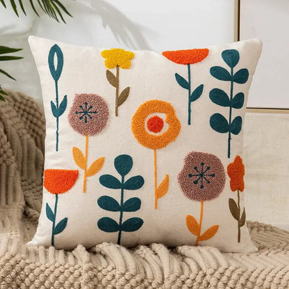 Cream-colored pillow cover with colorful orange teal mauve floral embroidery for living room decor