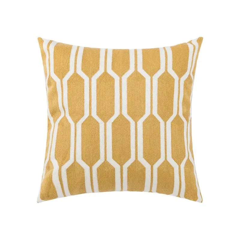 Embroidered green and gold fish pillow cover with mustard yellow floral geometric woven fabric for living room decor