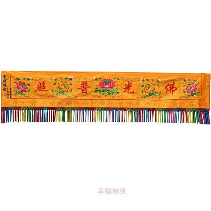 A vibrant orange embroidered home temple banner with pink lotus flowers red Chinese characters and colorful fringe decorbites Buddhist worship set