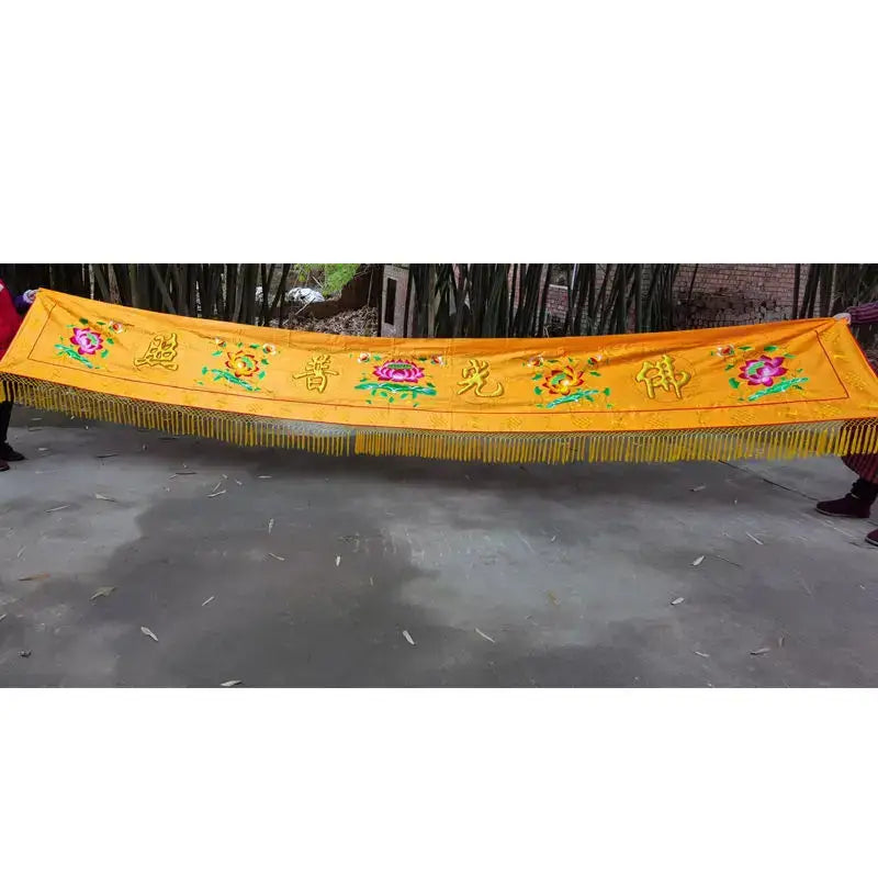 Vibrant yellow silk home temple banner with embroidered Chinese characters floral motifs and golden fringe decorbites buddhist worship set