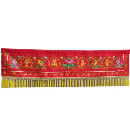 Embroidered red and gold buddhist home temple banner with golden Chinese characters green floral patterns and yellow fringe