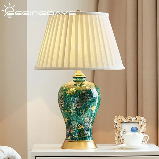 Emerald green ceramic table lamp with golden leaf green accents and floral decorbites golden leaf pattern for living room decor