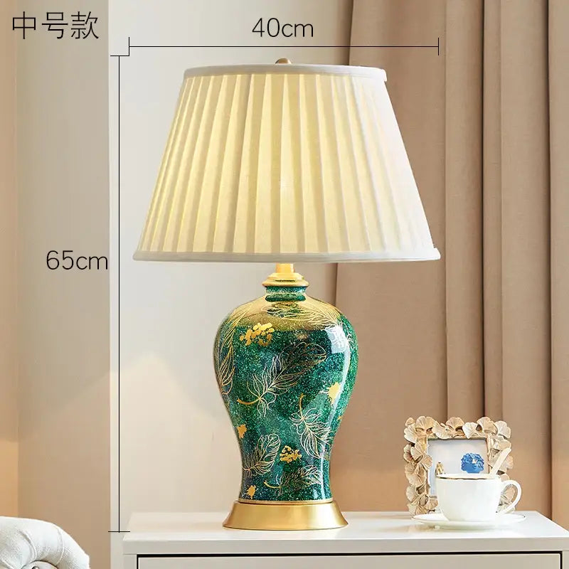 Emerald green floral ceramic table lamp with gold accents and pleated cream shade for decorbites golden leaf decor