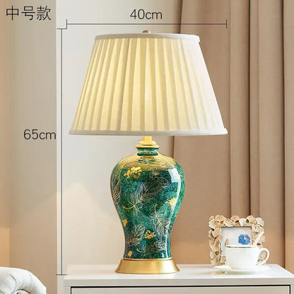 Emerald green floral ceramic table lamp with gold accents and pleated cream shade for decorbites golden leaf decor