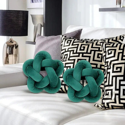Emerald green velvet lumbar cushion with star knotted design perfect for bedroom decorbites green star style