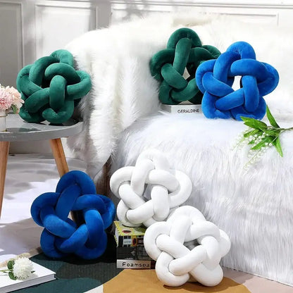 Plush velvet lumbar cushion in green star knot shape with emerald green royal blue and white colors by decorbites green star