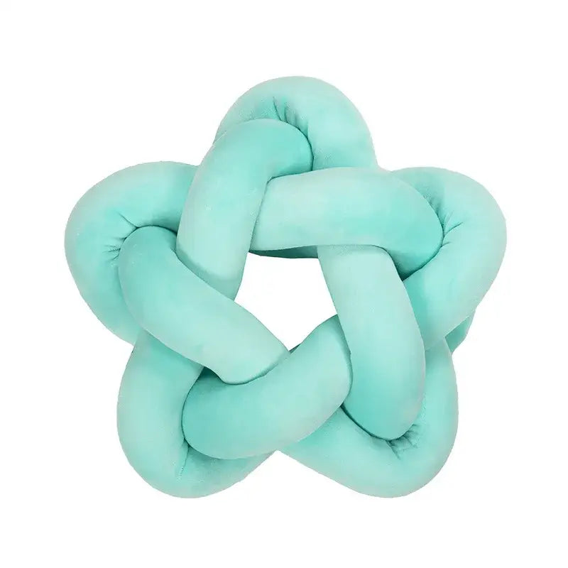 Emerald green star knotted lumbar cushion made of soft velvet plush with a cozy texture for bedroom decorbites green star