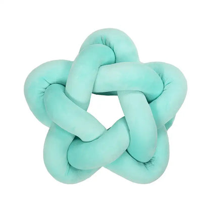 Emerald green star knotted lumbar cushion made of soft velvet plush with a cozy texture for bedroom decorbites green star