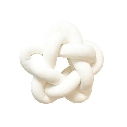 White plush velvet knot-shaped lumbar cushion complementing decorbites green star bedroom pillow decor
