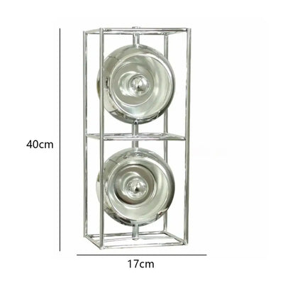 A sleek chrome-framed decorative shelf with two reflective glass bowls complements the dimmable led nordic table lamp