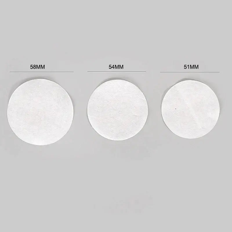 Three circular white paper espresso coffee filter papers in 58mm 54mm and 51mm by decorbites kitchen accessory pack