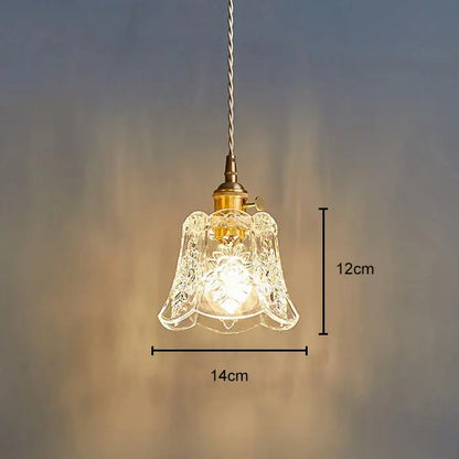 Delicate 12cm tall glass pendant light with etched bell-shaped shade and polished copper brass hardware for dining room