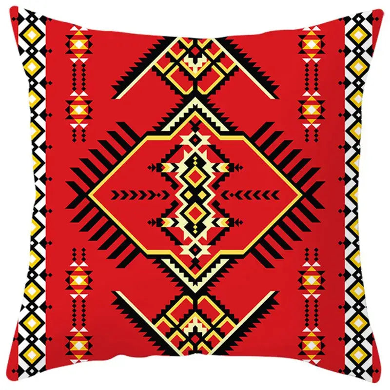 Vibrant red pillow cover with bold black yellow and cream ethnic bohemian geometric patterns for living room decorbites decor