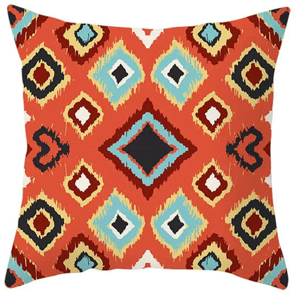 Vibrant orange pillow cover with bold ethnic bohemian geometric pattern in turquoise black and cream for living room decorbites decor