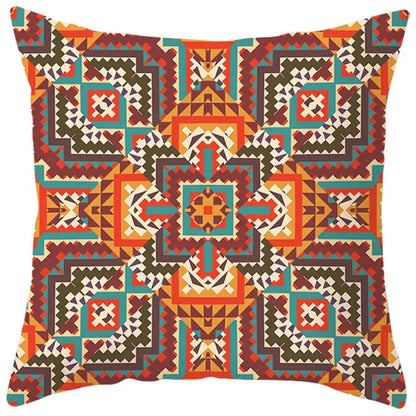 A square pillow cover with vibrant ethnic bohemian geometric pattern in orange teal brown and cream for living room decorbites decor